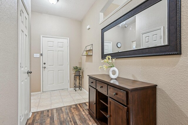 8833 Stirrup Way, Fort Worth, TX 76244 - foyer entrance featuring wood finished floors and baseboards