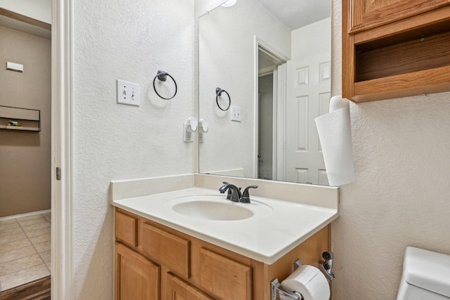 8833 Stirrup Way, Fort Worth, TX 76244 - bathroom with vanity, toilet, and tile patterned flooring