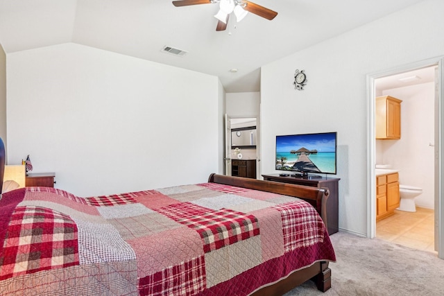 8833 Stirrup Way, Fort Worth, TX 76244 - bedroom with lofted ceiling, light carpet, ensuite bathroom, and ceiling fan
