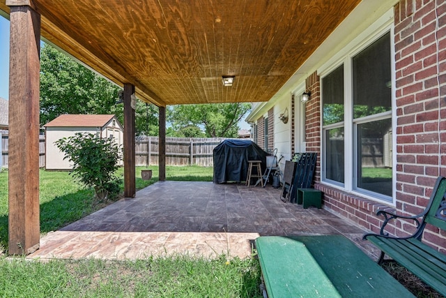 8833 Stirrup Way, Fort Worth, TX 76244 - view of patio / terrace featuring a storage shed, an outbuilding, and area for grilling