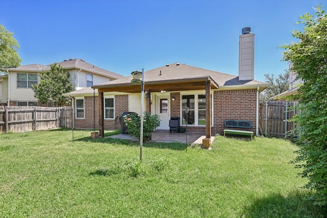 8833 Stirrup Way, Fort Worth, TX 76244 - rear view of house featuring brick siding, a patio area, and a chimney