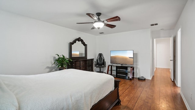 12712 Feathering Dr, Frisco, TX 75036 - bedroom with hardwood / wood-style flooring, baseboards, and ceiling fan