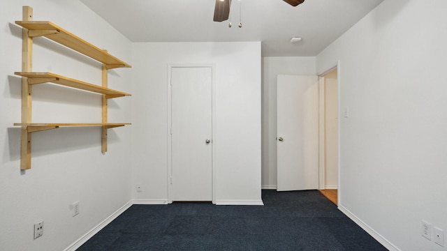 12712 Feathering Dr, Frisco, TX 75036 - unfurnished bedroom featuring baseboards, dark carpet, and ceiling fan