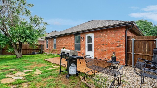 12712 Feathering Dr, Frisco, TX 75036 - back of property featuring brick siding and a shingled roof