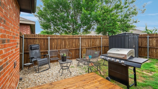 12712 Feathering Dr, Frisco, TX 75036 - wooden deck featuring area for grilling and a fenced backyard