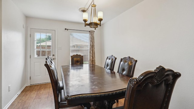 12712 Feathering Dr, Frisco, TX 75036 - dining space with light wood-style floors, a chandelier, and baseboards