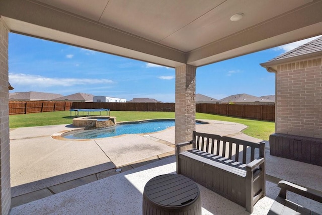 view of patio featuring a pool with connected hot tub
