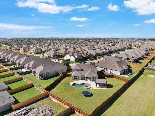 aerial perspective of suburban area featuring a pool