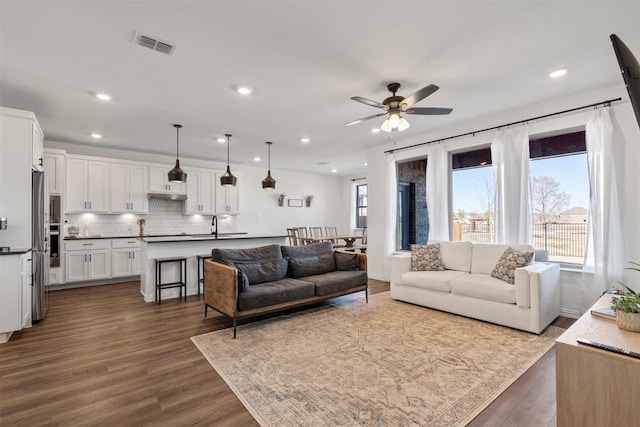1420 Escondido Dr, Fort Worth, TX 76052 - living room featuring a ceiling fan, healthy amount of natural light, dark wood-style flooring, and recessed lighting