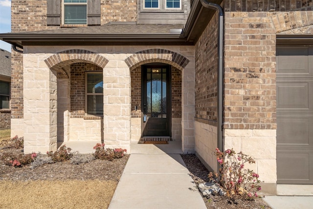 1420 Escondido Dr, Fort Worth, TX 76052 - view of exterior entry featuring brick siding and a garage