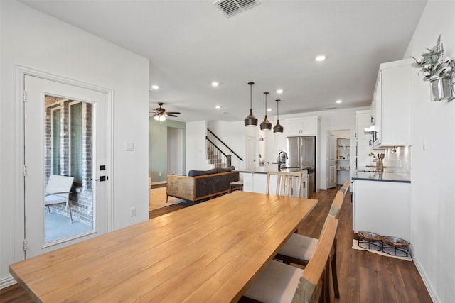 1420 Escondido Dr, Fort Worth, TX 76052 - dining space featuring dark wood-style flooring, stairway, recessed lighting, and a ceiling fan