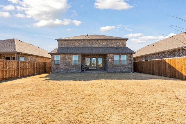 1420 Escondido Dr, Fort Worth, TX 76052 - back of property featuring brick siding, a shingled roof, and a fenced backyard