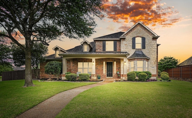 2099 Remington Ln, Frisco, TX 75033 - view of front of house featuring a standing seam roof, brick siding, and stone siding