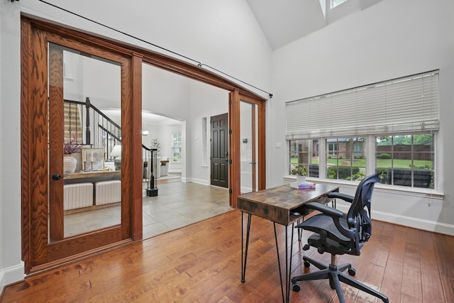 2099 Remington Ln, Frisco, TX 75033 - office area featuring wood-type flooring, baseboards, and high vaulted ceiling
