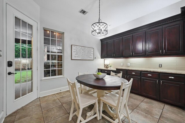 2099 Remington Ln, Frisco, TX 75033 - dining room with a chandelier and baseboards