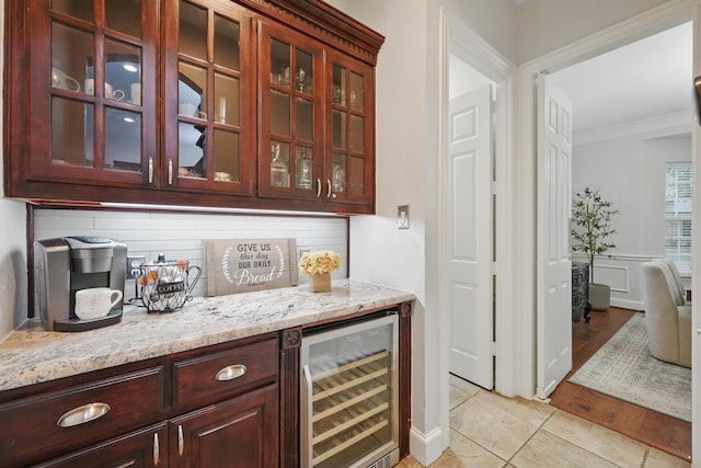 2099 Remington Ln, Frisco, TX 75033 - indoor dry bar featuring wine cooler, crown molding, and tasteful backsplash
