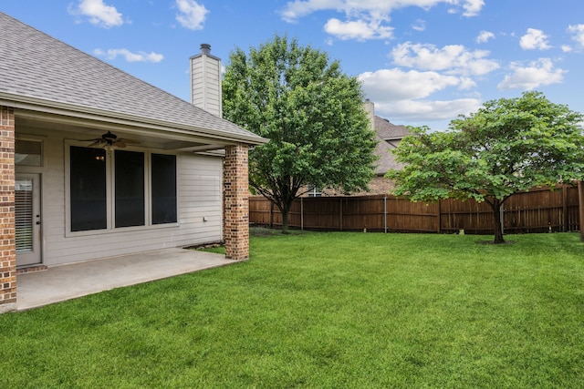 view of yard featuring a patio and ceiling fan