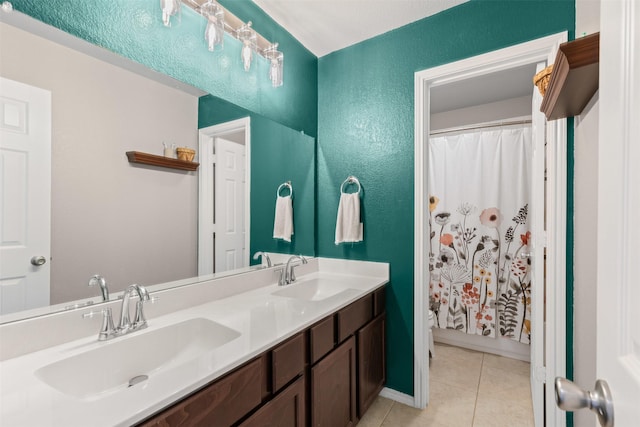 1744 Wildflower Ln, Wylie, TX 75098 - bathroom featuring tile patterned flooring, double vanity, a textured wall, and curtained shower