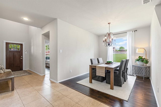 1744 Wildflower Ln, Wylie, TX 75098 - dining space with a chandelier, baseboards, and light tile patterned floors