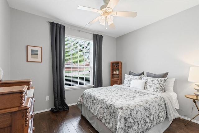 1744 Wildflower Ln, Wylie, TX 75098 - bedroom with dark wood-style flooring, baseboards, and a ceiling fan