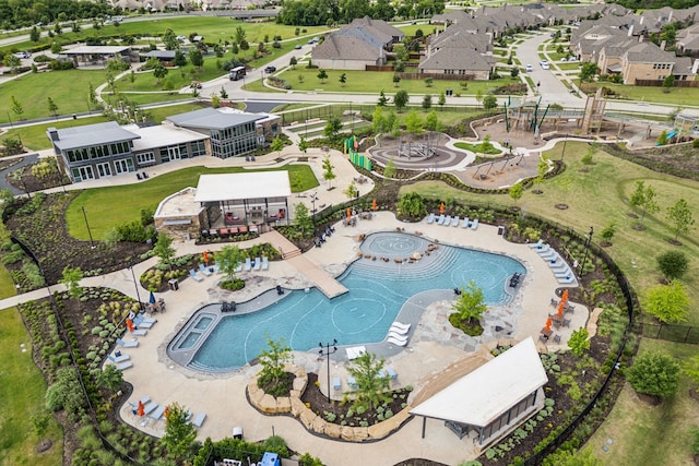 aerial view of property's location featuring a pool area