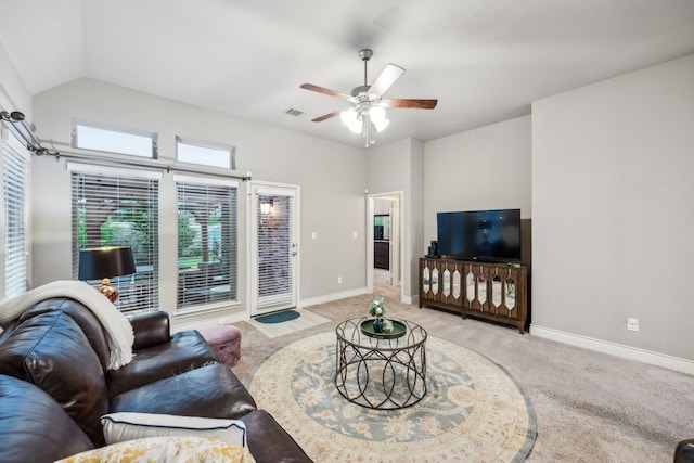 carpeted living room with a ceiling fan, baseboards, and vaulted ceiling