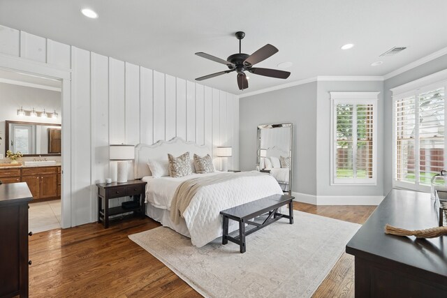 304 Nora Ln, Argyle, TX 76226 - bedroom with crown molding, a sink, light wood-style flooring, baseboards, and recessed lighting