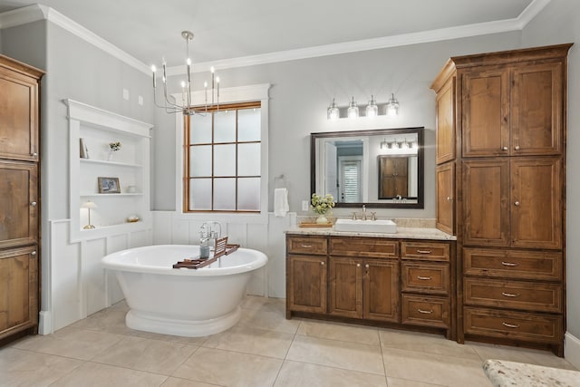 304 Nora Ln, Argyle, TX 76226 - full bathroom featuring a freestanding tub, vanity, ornamental molding, a chandelier, and tile patterned flooring