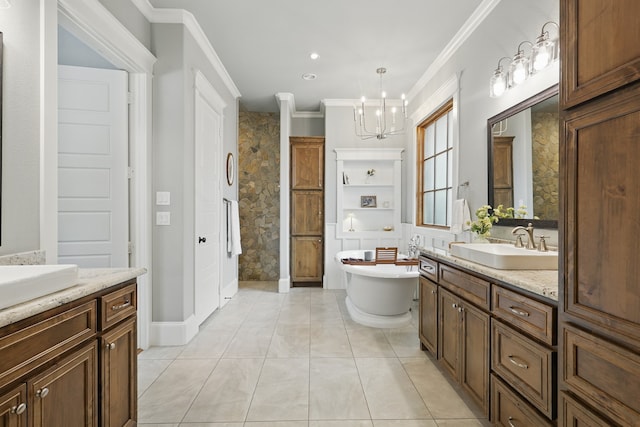 304 Nora Ln, Argyle, TX 76226 - bathroom with two vanities, ornamental molding, a chandelier, a freestanding bath, and tile patterned flooring
