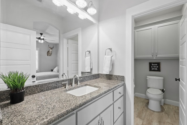 304 Nora Ln, Argyle, TX 76226 - ensuite bathroom with vanity, a ceiling fan, toilet, and baseboards