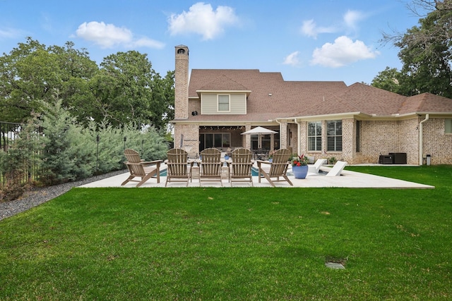 304 Nora Ln, Argyle, TX 76226 - rear view of house with a patio, a chimney, an outdoor living space, and a yard