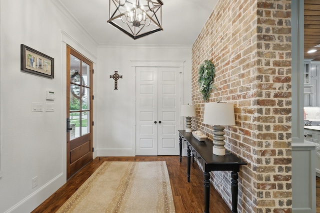 304 Nora Ln, Argyle, TX 76226 - foyer with wood finished floors, baseboards, a chandelier, and ornamental molding
