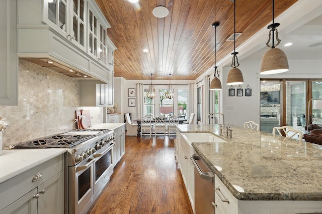 304 Nora Ln, Argyle, TX 76226 - kitchen featuring appliances with stainless steel finishes, a sink, wooden ceiling, dark wood-style floors, and a large island with sink