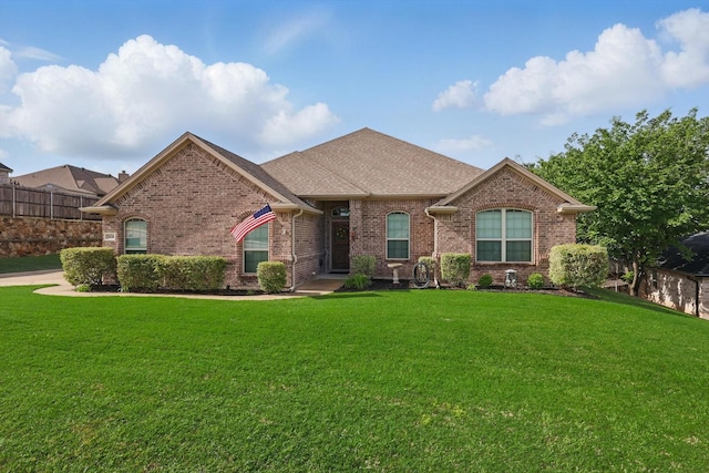 2134 Sagewood Dr, Weatherford, TX 76087 - french country home featuring brick siding and a shingled roof