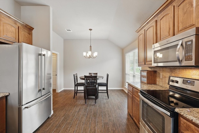 2134 Sagewood Dr, Weatherford, TX 76087 - kitchen featuring appliances with stainless steel finishes, a chandelier, dark wood-type flooring, backsplash, and baseboards