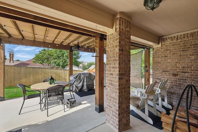 2134 Sagewood Dr, Weatherford, TX 76087 - view of patio featuring outdoor dining space, fence, a shed, an outbuilding, and area for grilling