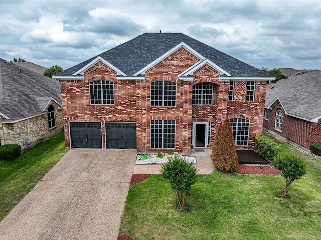 525 Magnolia Trl, Desoto, TX 75115 - traditional home with a garage, concrete driveway, a front yard, and brick siding