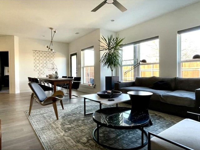1967 Bayside St, Dallas, TX 75212 - living room with wood finished floors, a ceiling fan, and baseboards