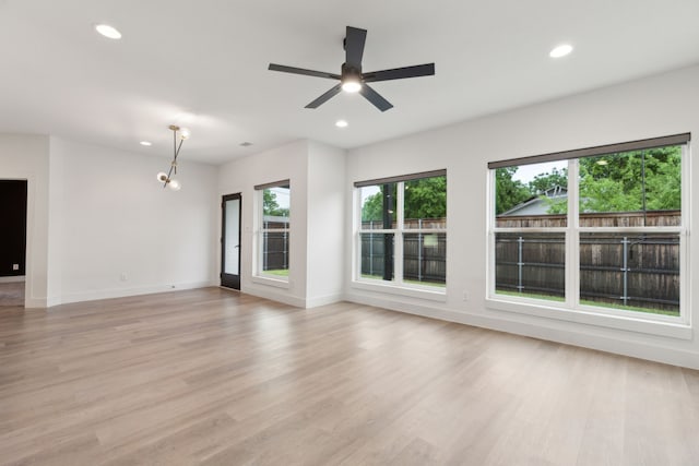 1967 Bayside St, Dallas, TX 75212 - unfurnished living room with recessed lighting, light wood finished floors, baseboards, and a ceiling fan