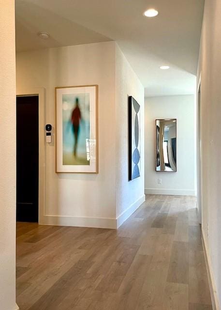 1967 Bayside St, Dallas, TX 75212 - hallway with wood finished floors, baseboards, and recessed lighting