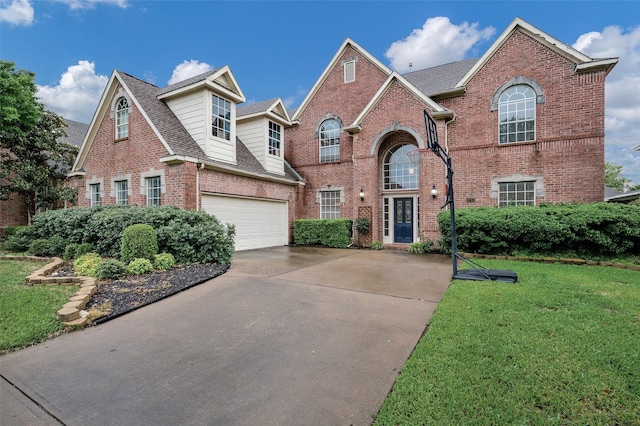 2713 Pasadena Pl, Flower Mound, TX 75022 - traditional-style home with brick siding, driveway, an attached garage, a front lawn, and roof with shingles