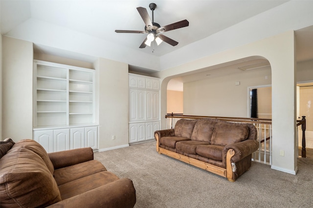 2713 Pasadena Pl, Flower Mound, TX 75022 - living room featuring light carpet, a ceiling fan, baseboards, and arched walkways
