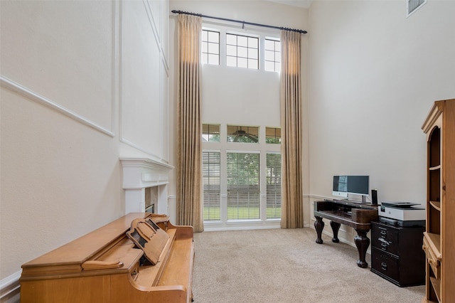 2713 Pasadena Pl, Flower Mound, TX 75022 - carpeted office space featuring a towering ceiling, plenty of natural light, and a ceiling fan