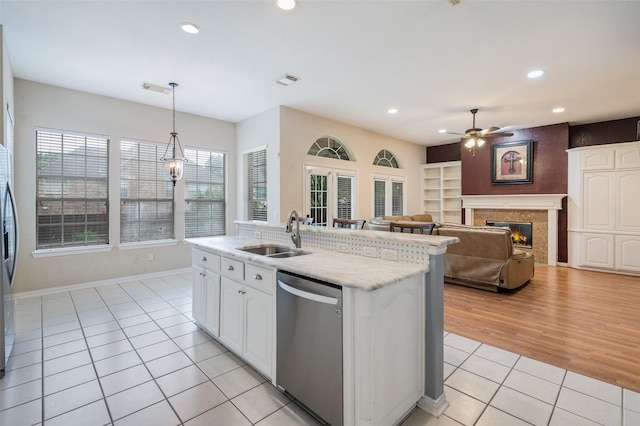 2713 Pasadena Pl, Flower Mound, TX 75022 - kitchen featuring stainless steel appliances, a sink, light tile patterned flooring, ceiling fan, and recessed lighting