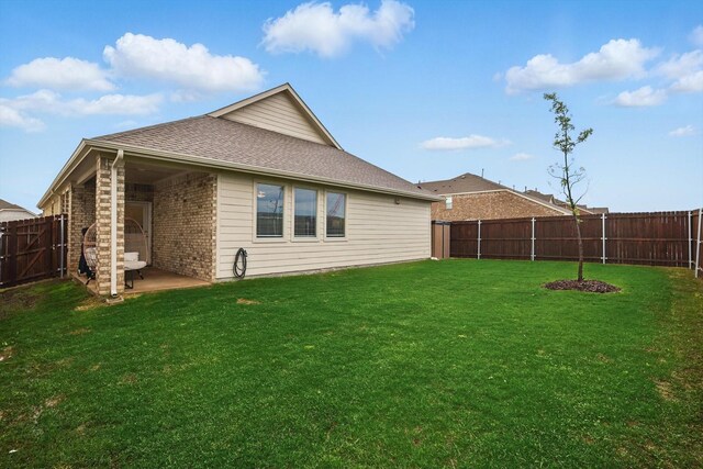 1223 Sequoia Ln, Princeton, TX 75407 - rear view of house featuring a patio area, a shingled roof, and brick siding