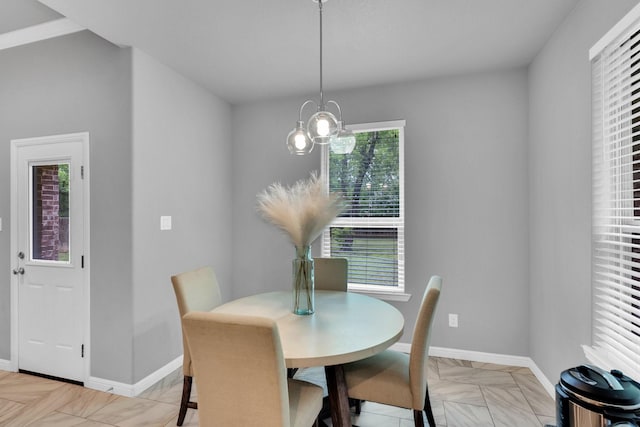 306 N Pendell Ave, Cleburne, TX 76033 - dining space featuring baseboards and a chandelier