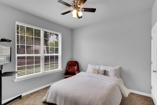 306 N Pendell Ave, Cleburne, TX 76033 - bedroom featuring carpet, baseboards, and a ceiling fan