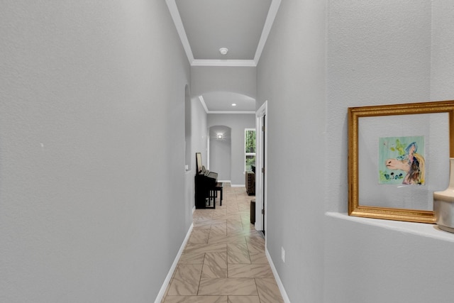 306 N Pendell Ave, Cleburne, TX 76033 - hallway featuring arched walkways, crown molding, and baseboards