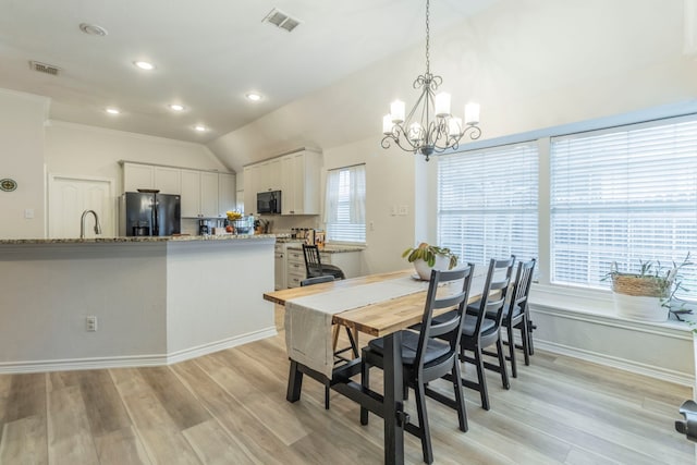 5428 Lake Powell Dr, Fort Worth, TX 76137 - dining space featuring a chandelier, light wood-style flooring, lofted ceiling, recessed lighting, and baseboards