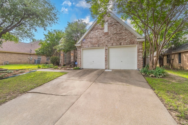 5428 Lake Powell Dr, Fort Worth, TX 76137 - traditional-style home featuring brick siding, a front yard, driveway, and central AC unit